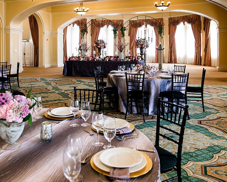 table setup with purple cloth and chairs in ballroom